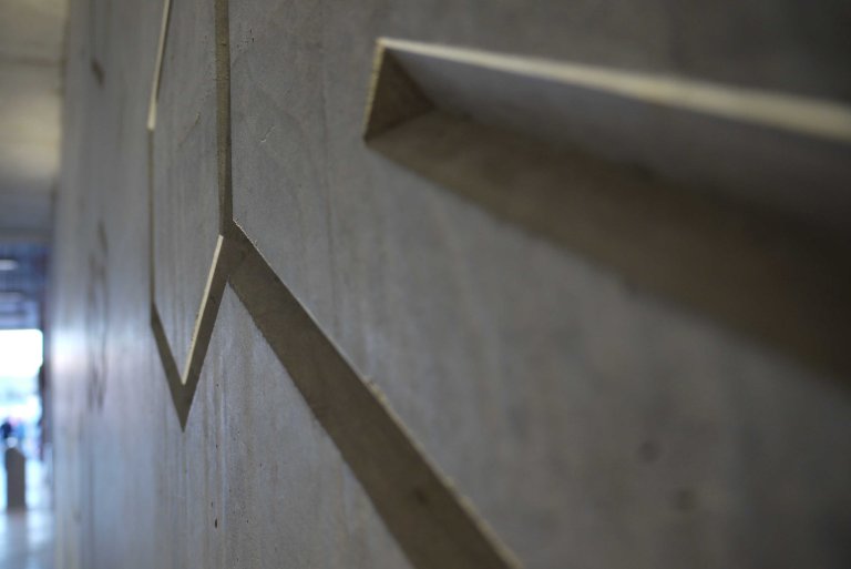 Hackney Wick Station’s Concrete Molecular Chemistry Frieze - detail  view of triangular deboss- Collaborating Artist Wendy Hardie 2018