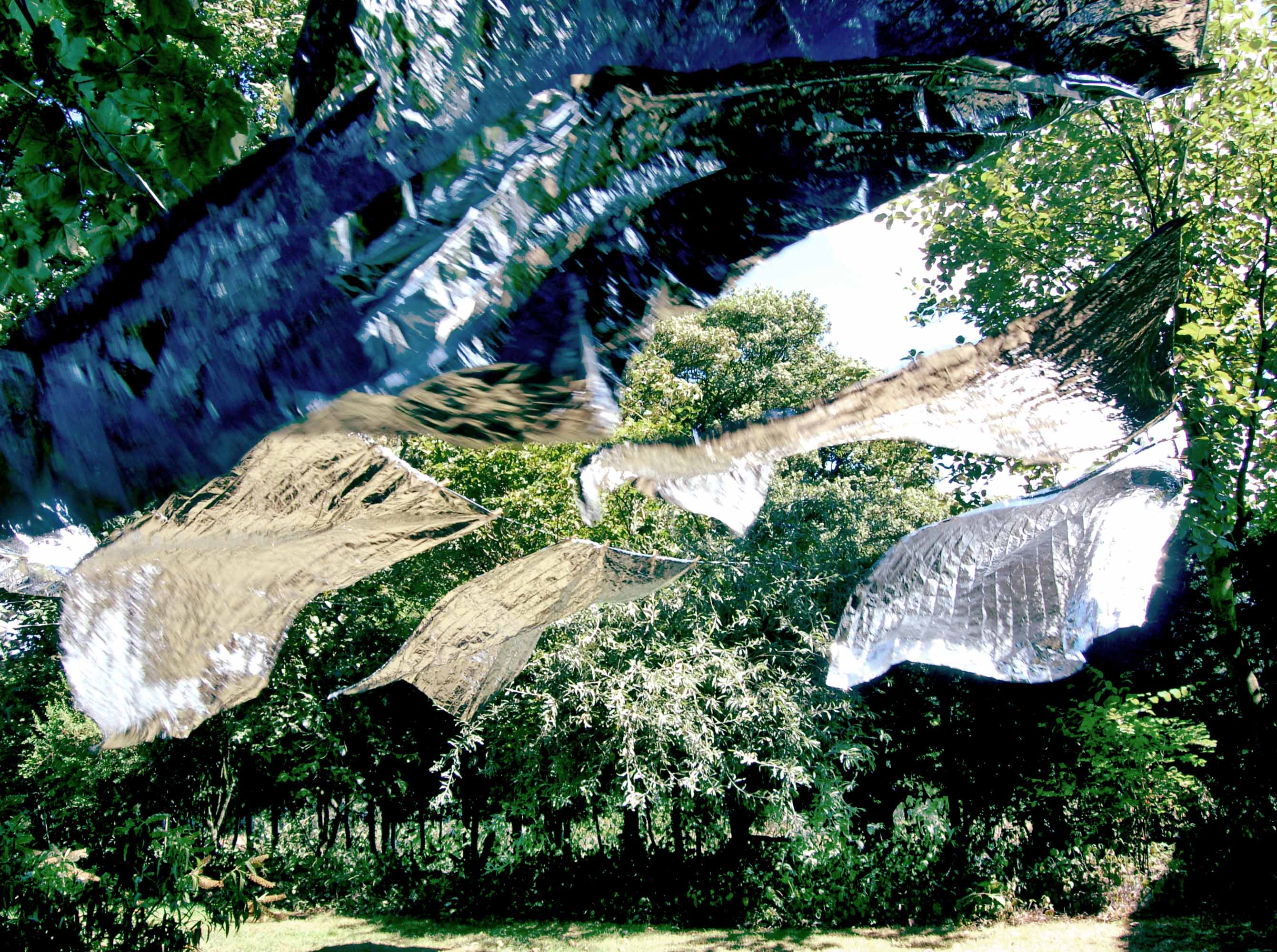 'Laundry Day' by artist Wendy Hardie. A site specific environmental art installation of rows of emergency blankets on silver washing lines, Durham 2006.