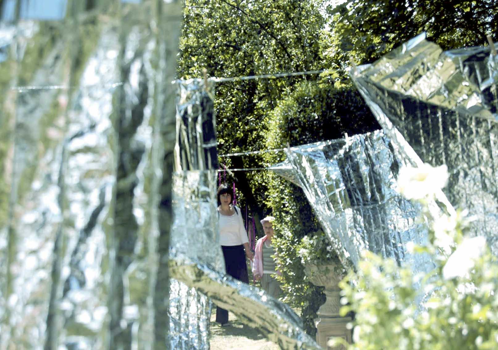'Laundry Day' by artist Wendy Hardie. A site specific environmental art installation of rows of emergency blankets on silver washing lines, Durham 2006.