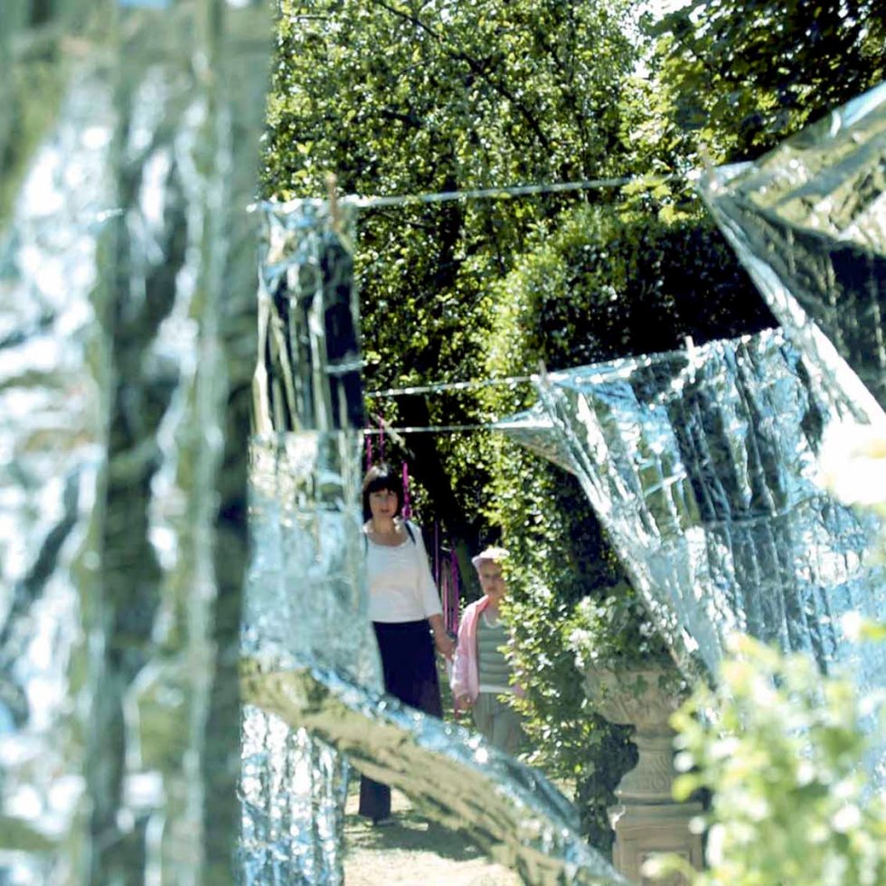 'Laundry Day' by artist Wendy Hardie. A site specific environmental art installation of rows of emergency blankets on silver washing lines, Durham 2006.